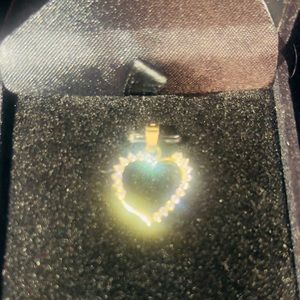 10k gold Heart Pendant with 18 cubic zirconia stones.